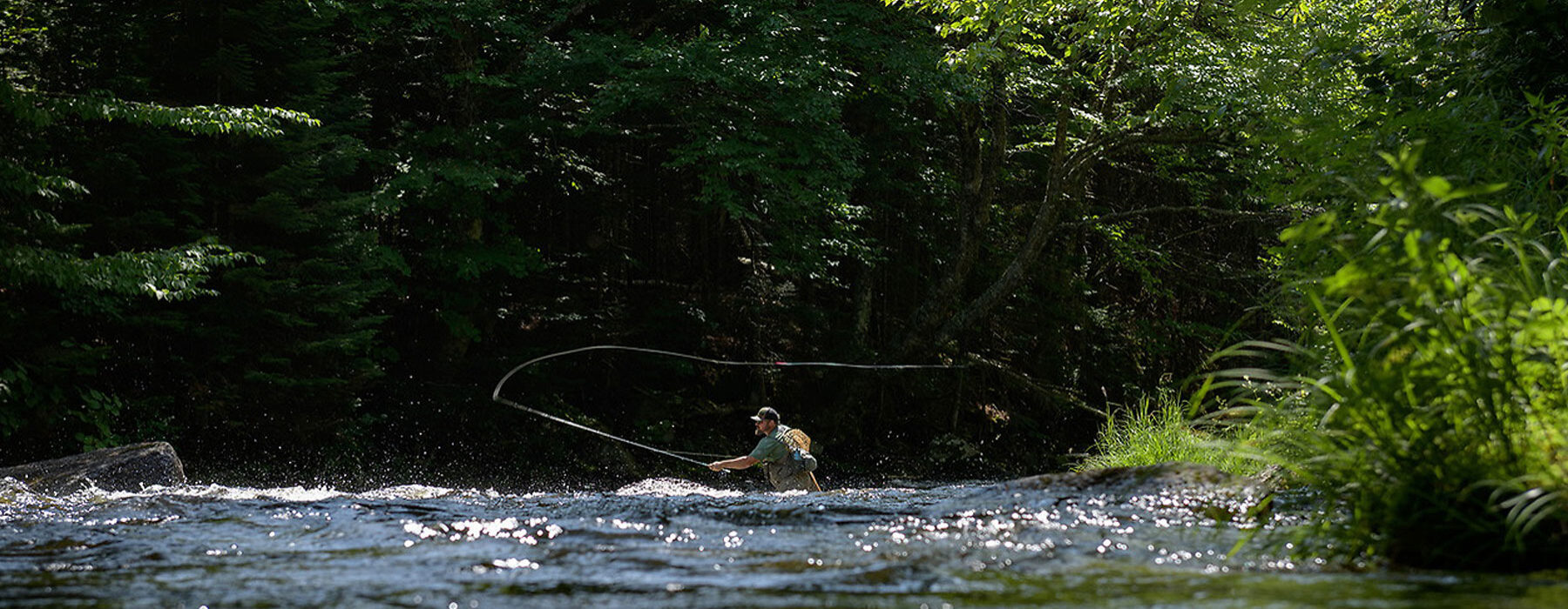 Fly fishing in a Vermont river.  © Kurt Budliger