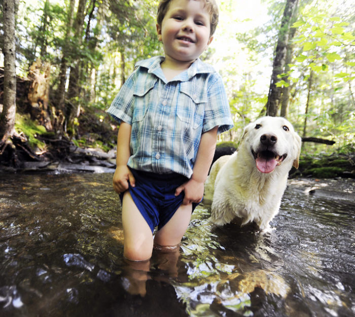Kid and dog in Jones Brook in Greensboro, VT © Jay Ericson