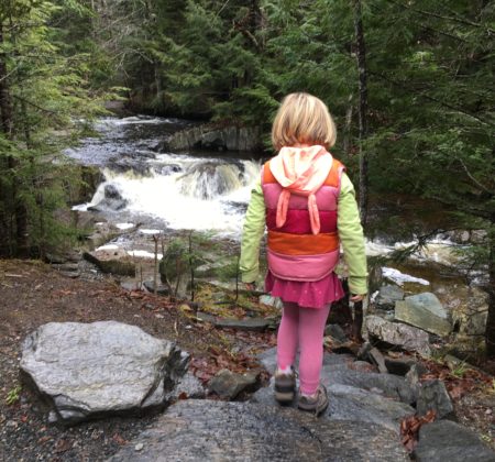 A child walking down stairs at the North Branch Cascades Trail in Vermont.