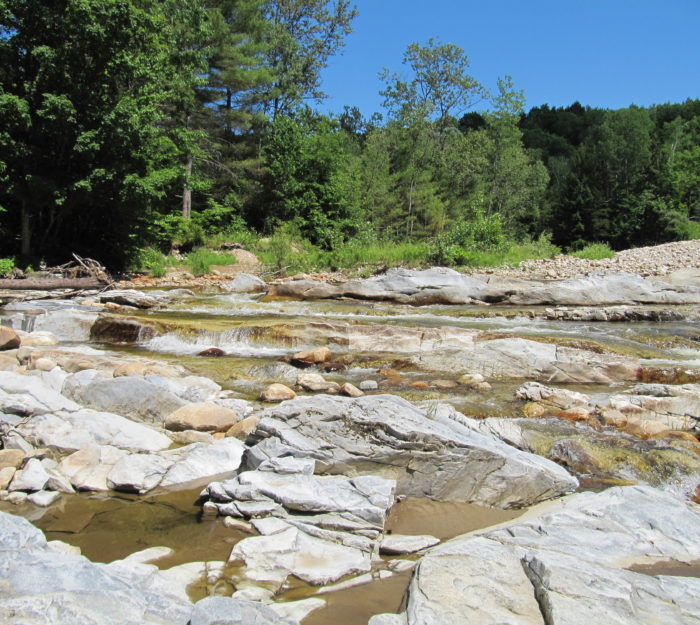 Rocky pools below Lower Clarendon Gorge make for great summer swimming holes.