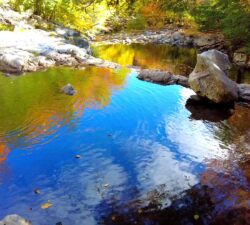 Autumn reflections in the water at Buttermilk Falls