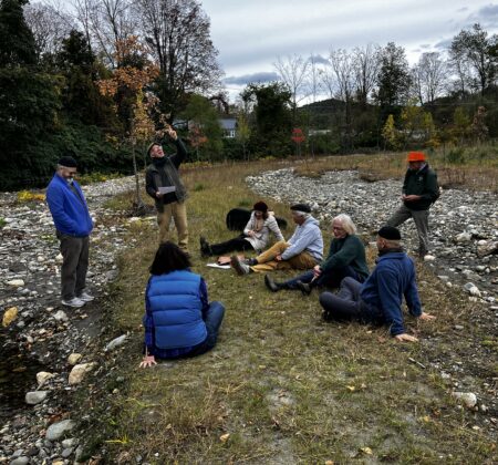 Group sits and meditates along the Whetstone Brook in Brattleboro.